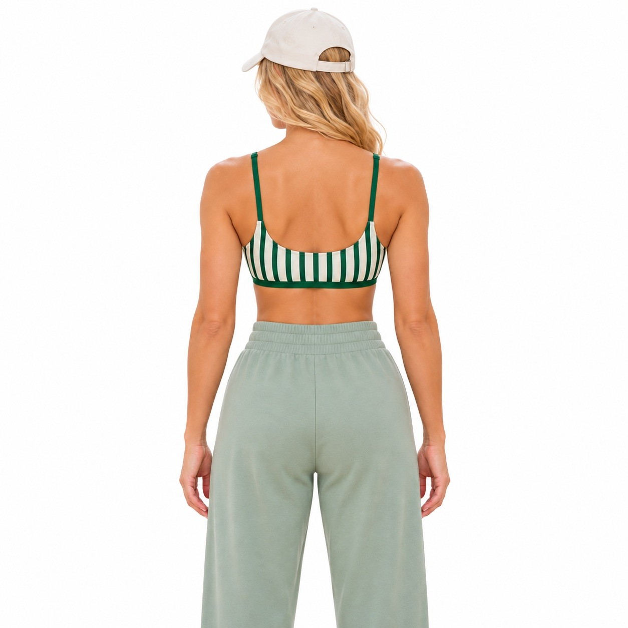 Back view of the green striped sports bra with a scoop back neckline and solid green underband