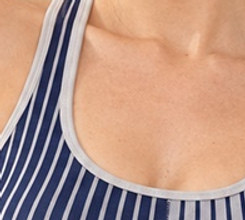 Close-up of the light neckline binding and shoulder strap on the striped U-neck yoga bra