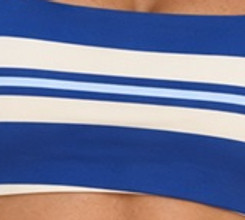 Close-up of wide white bands and fine blue stripes on the stretch-knit yoga bra fabric