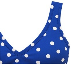 Close-up of the V-neck edge binding and wide strap on the blue polka dot yoga bra