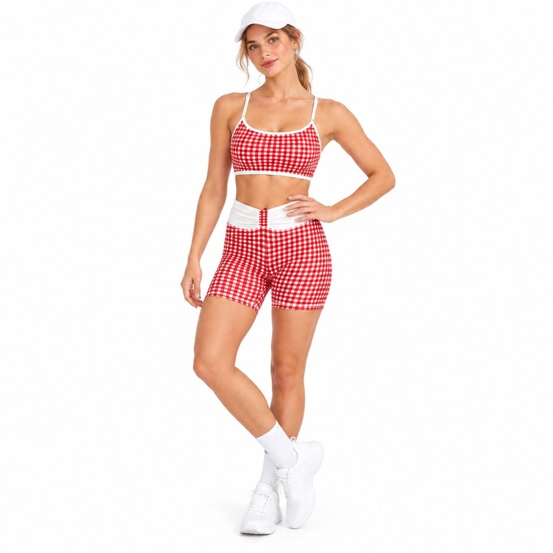 Model showing the ruched white high-rise waistband and gingham biker shorts
