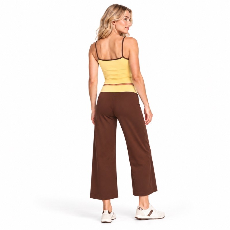 Back view of the yellow cami and brown yoga pants with a contrasting yellow fold-over waistband