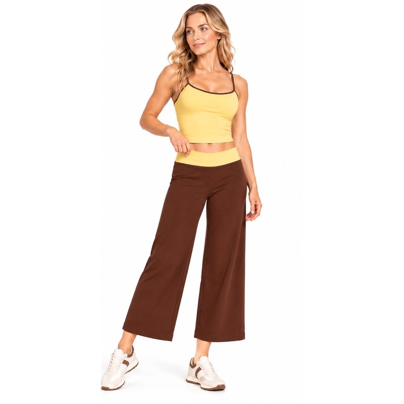 Front view showing the cropped wide-leg cut and contrast waistband of the brown yoga pants