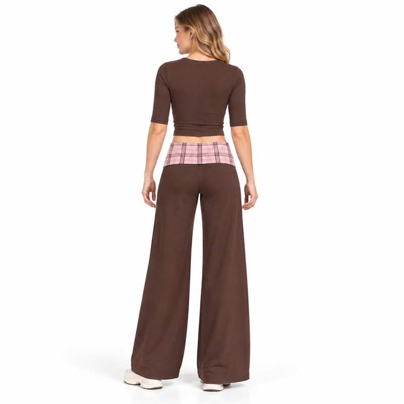 Rear view of the matching elbow-sleeve crop top and full-length wide-leg yoga pants