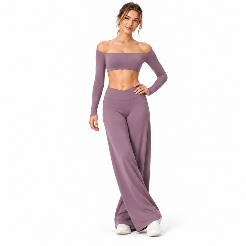 Model showing the V-shaped crossover waistband on the matching mauve yoga pants