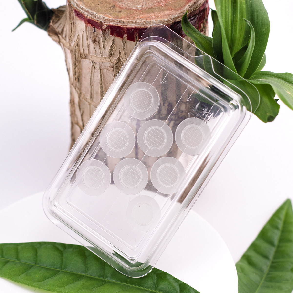 A woman applying a microdart patch to her cheek