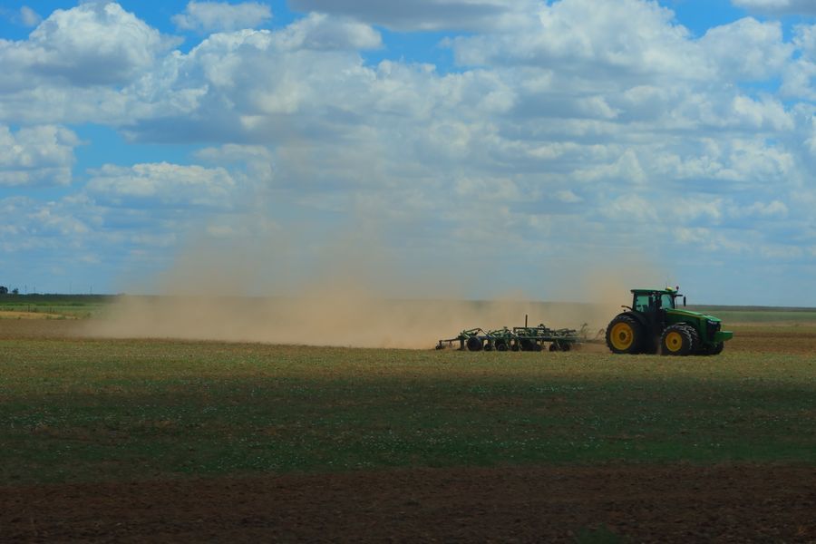 tractor in green field representing soil micronutrients and crop care