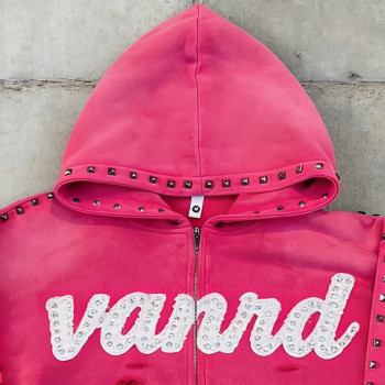 Custom zip up hoodie with stud trim and raw hem