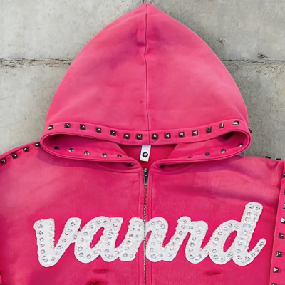 Custom zip up hoodie with stud trim and raw hem