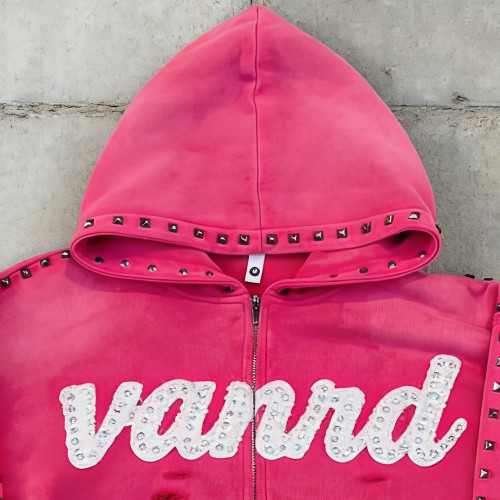 Custom zip up hoodie with stud trim and raw hem