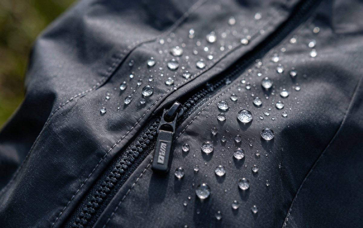 Waterproof rain jacket with sealed seams, water-resistant zipper, and DWR coating