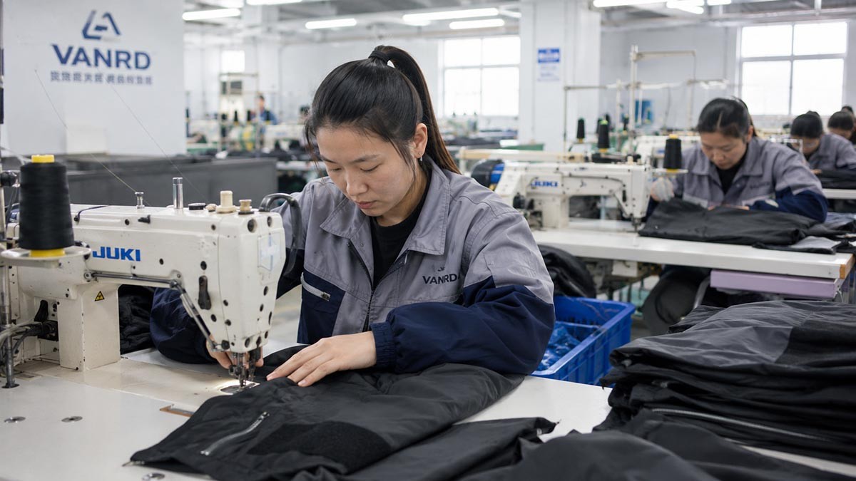 Clean apparel factory production workflow showing cutting, sewing, decoration, and bulk garment manufacturing