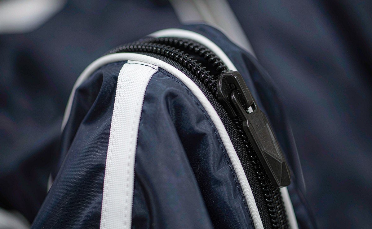 nylon track jacket zipper piping and woven tape detail