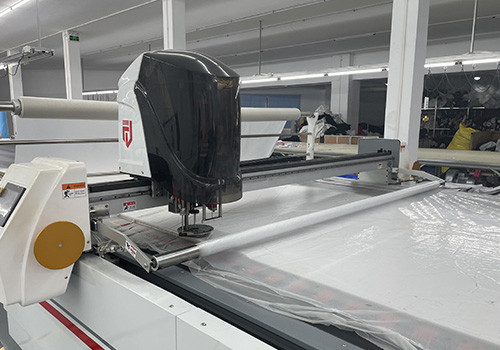 Automated fabric cutting equipment for bulk hoodie manufacturing