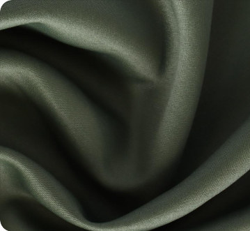 Olive flight satin fabric close-up showing smooth surface and reflective folds