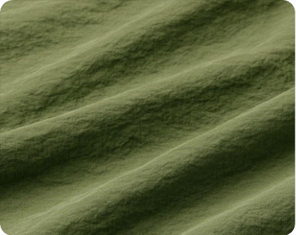 Olive Taslan fabric close-up showing a muted matte surface and visible texture