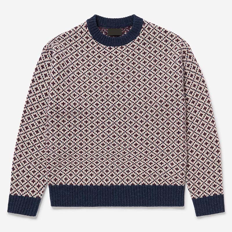 Men's sweater with a repeating navy and cream geometric knit pattern