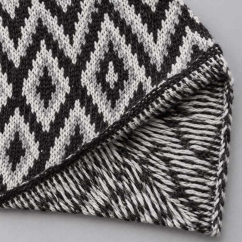 Jacquard knitted fabric showing the pattern face and reverse-side yarn floats