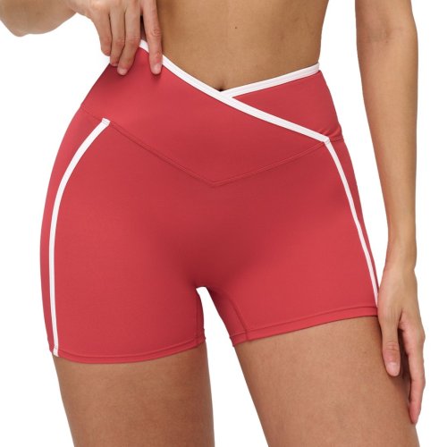 Nude-feel color-blocked yoga shorts with cross-waistband, tight-fitting shorts for outdoor running and fitness.