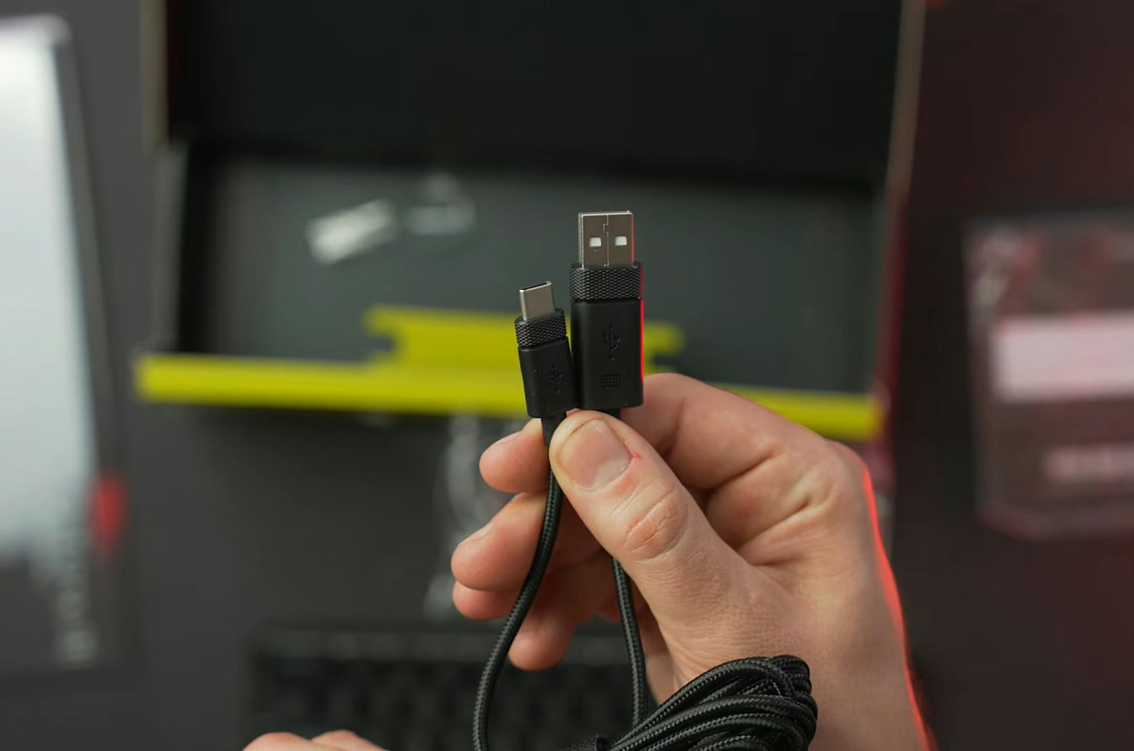 A USB-C cable plugging into an automotive neck light, showing charging convenience.