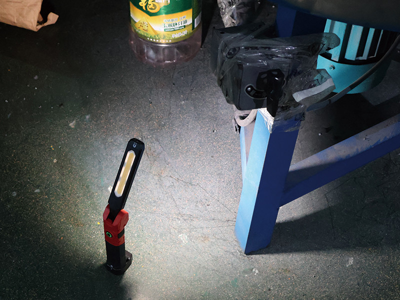 inspection work light illuminating industrial equipment maintenance area