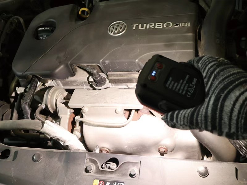 portable cordless flood light used to illuminate engine components during automotive maintenance