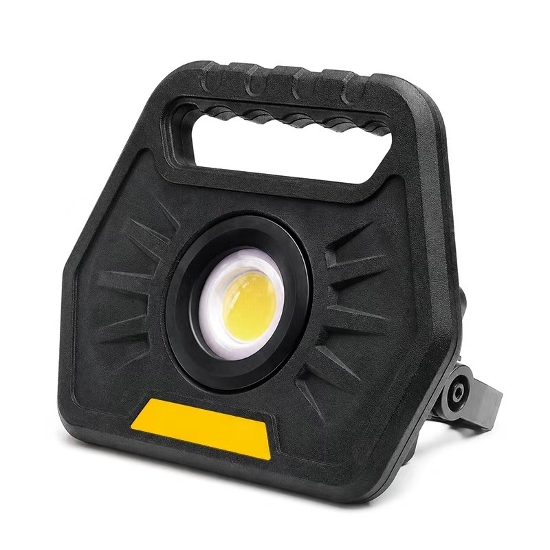 yellow custom work flood light with black housing, portable handle and swivel stand
