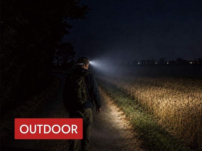 led headlamp used for hands-free night walking on a dark outdoor trail