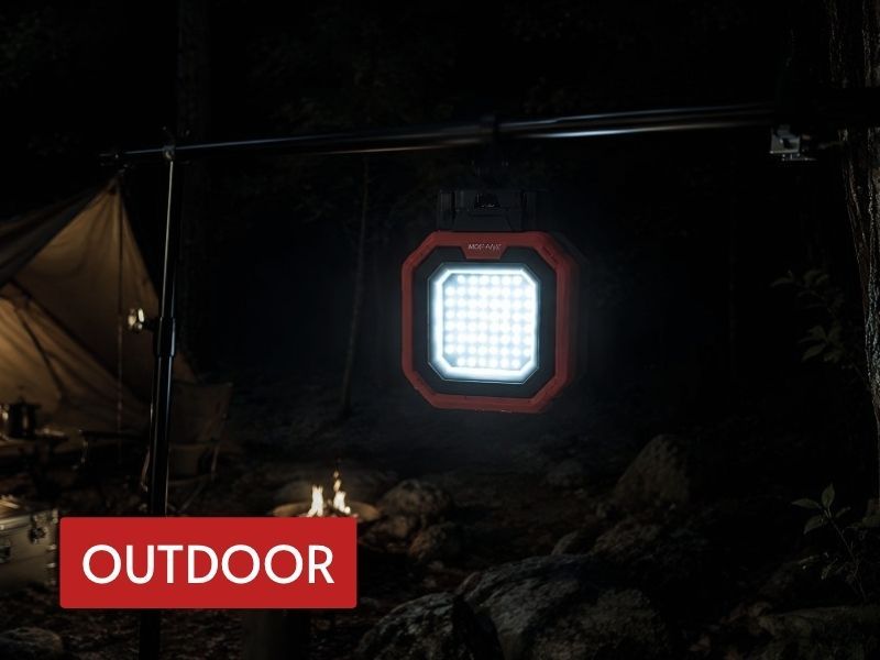bright led flood lamp hanging at a campsite to provide wide-area outdoor lighting at night