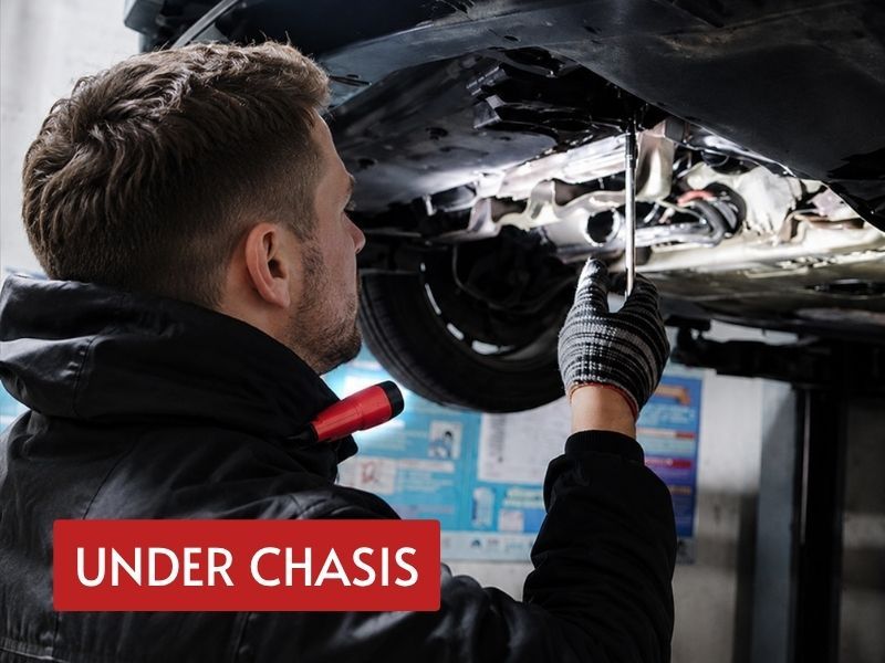 mechanic neck light worn during close under chassis inspection with both hands free for tools