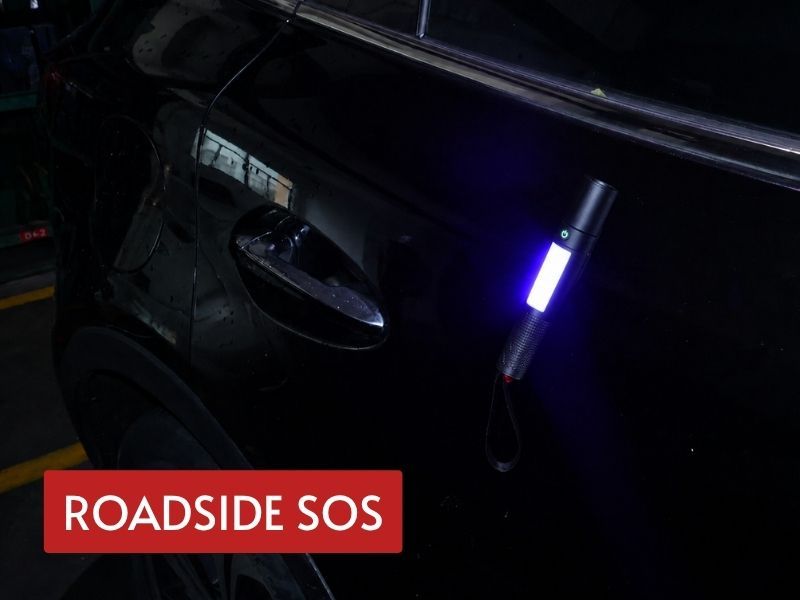 usb rechargeable flashlight magnetically mounted on a vehicle with side light active for roadside SOS visibility
