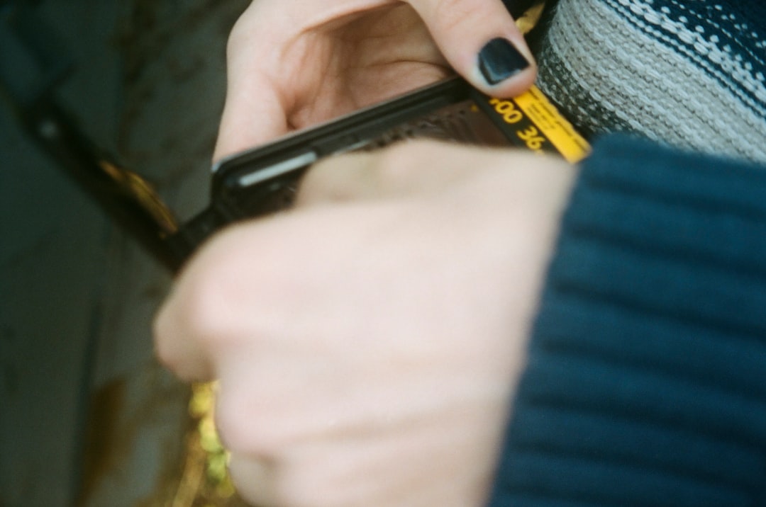 A person clipping a penlight into their shirt pocket, ready for the day