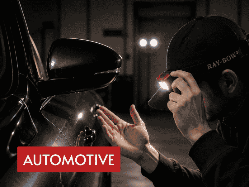 rechargeable headlamp used for hands-free automotive body inspection in a dark workshop