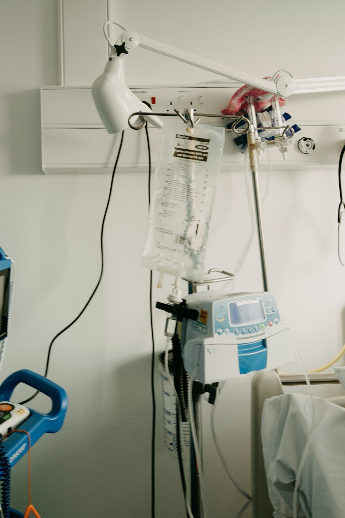 Hospital IV infusion equipment near a clinical bed