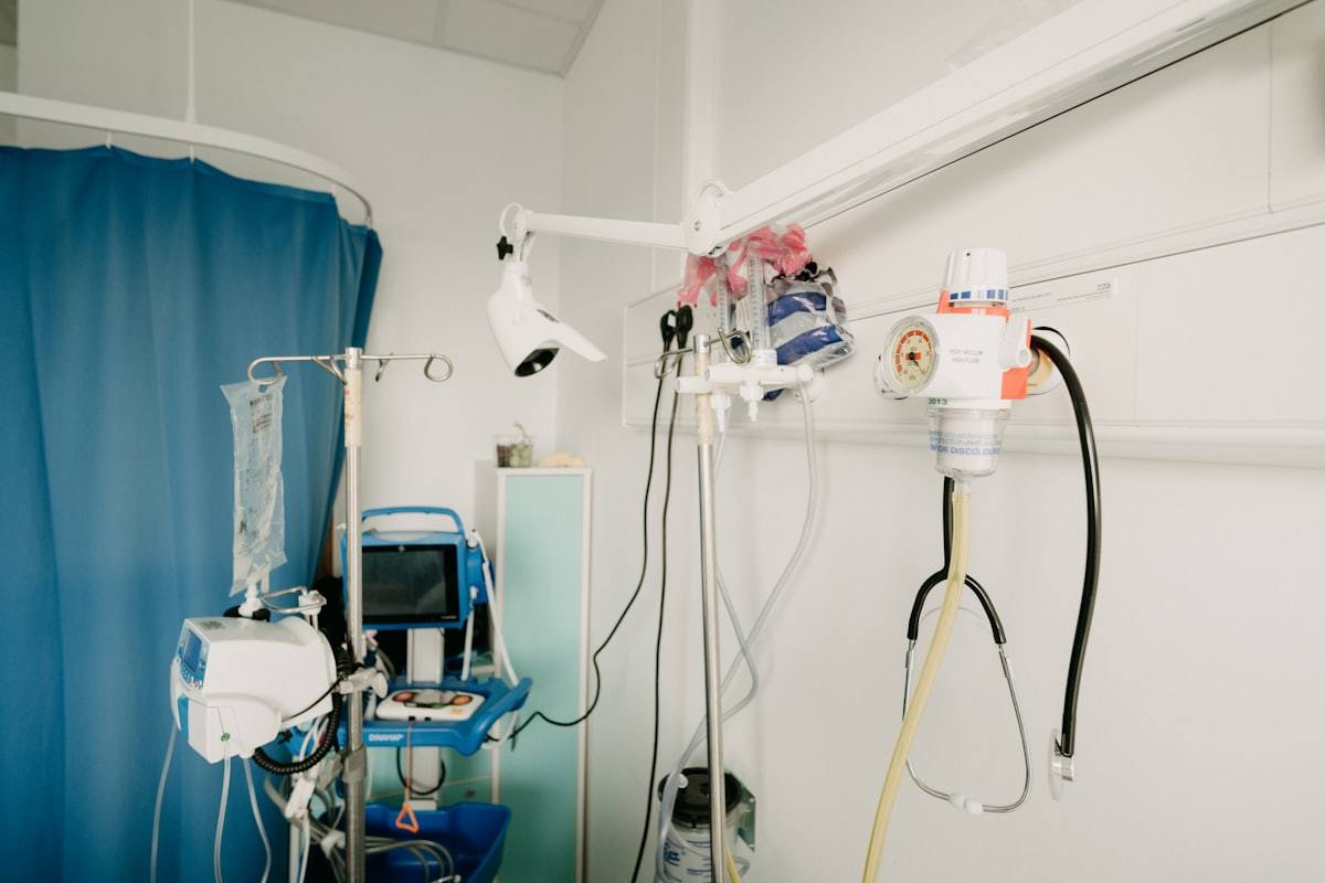 Hospital room with IV stand and medical equipment