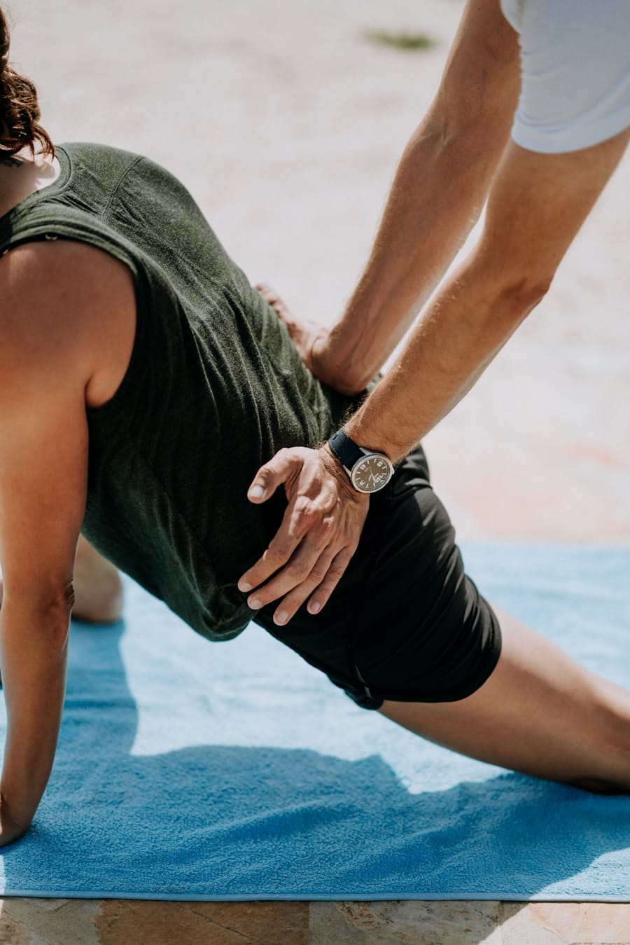 Therapist assisting a patient with hip and mobility work