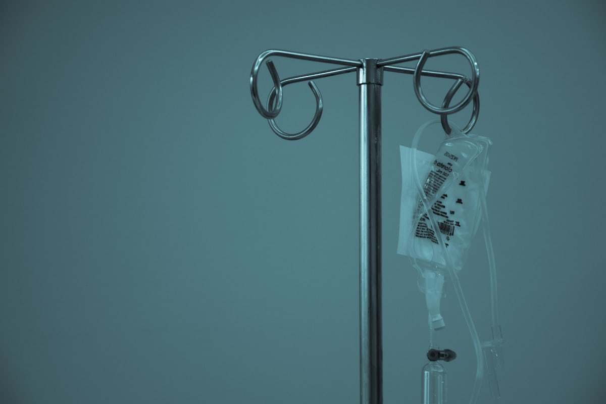 Intravenous fluid container in a clinical setting