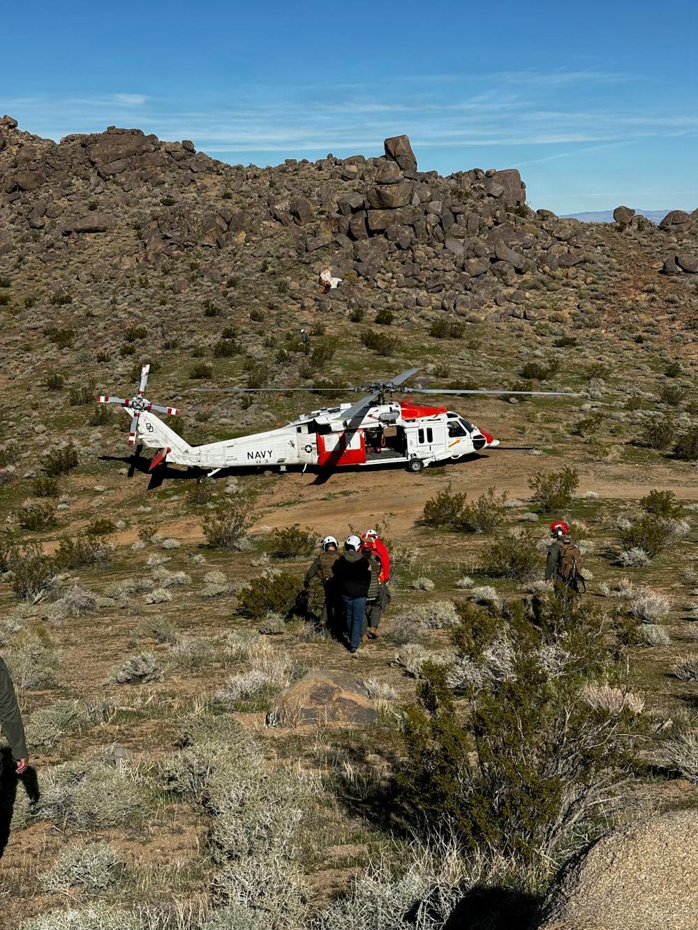 Search and rescue team operating in remote terrain