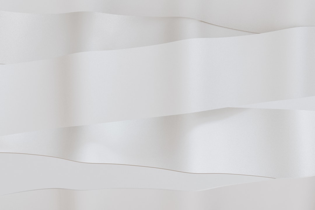 A collection of different plastic sign clips on a white background