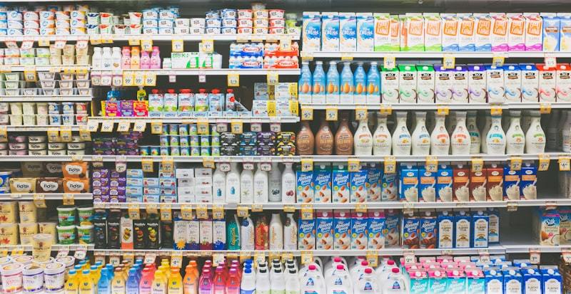 Commercial refrigerator display with organized beverage products in retail environment