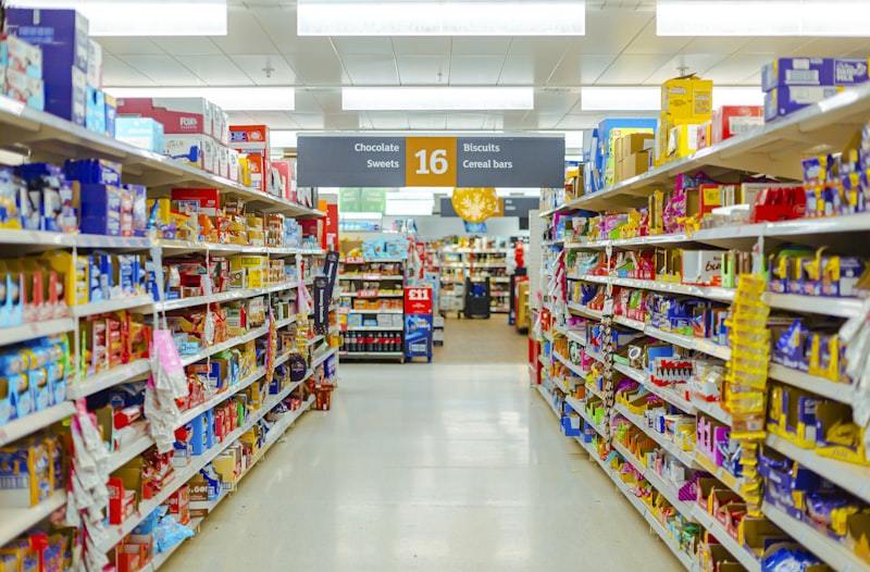Well-organized supermarket produce and grocery display section