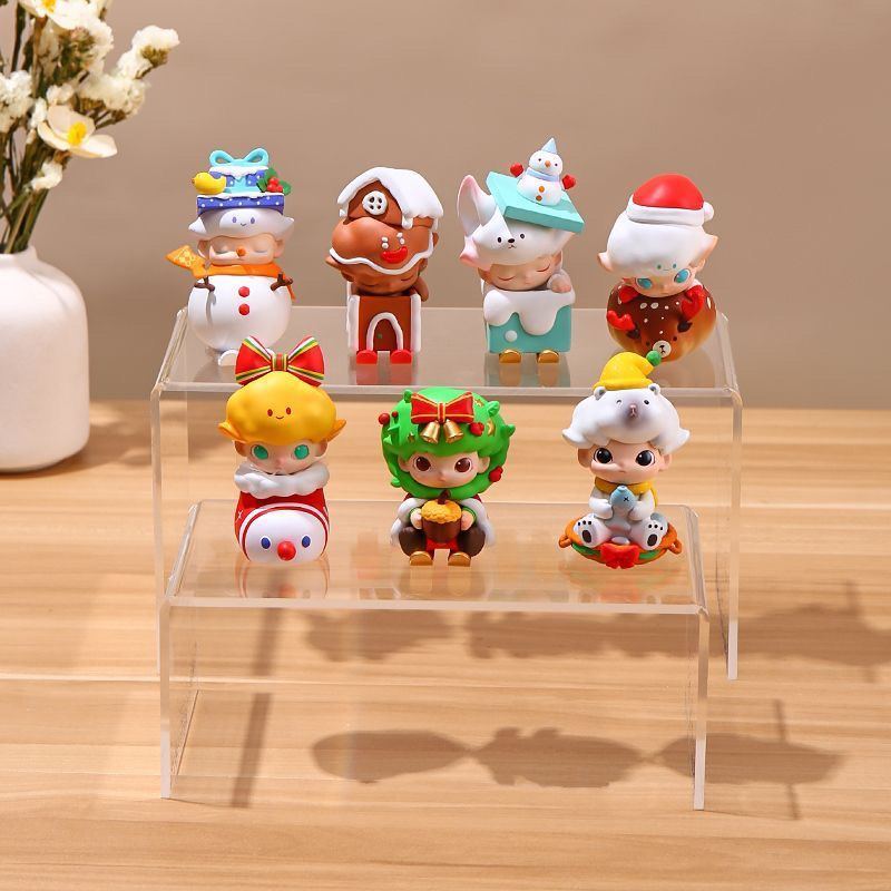 Clear acrylic tiered display stands in a retail setting