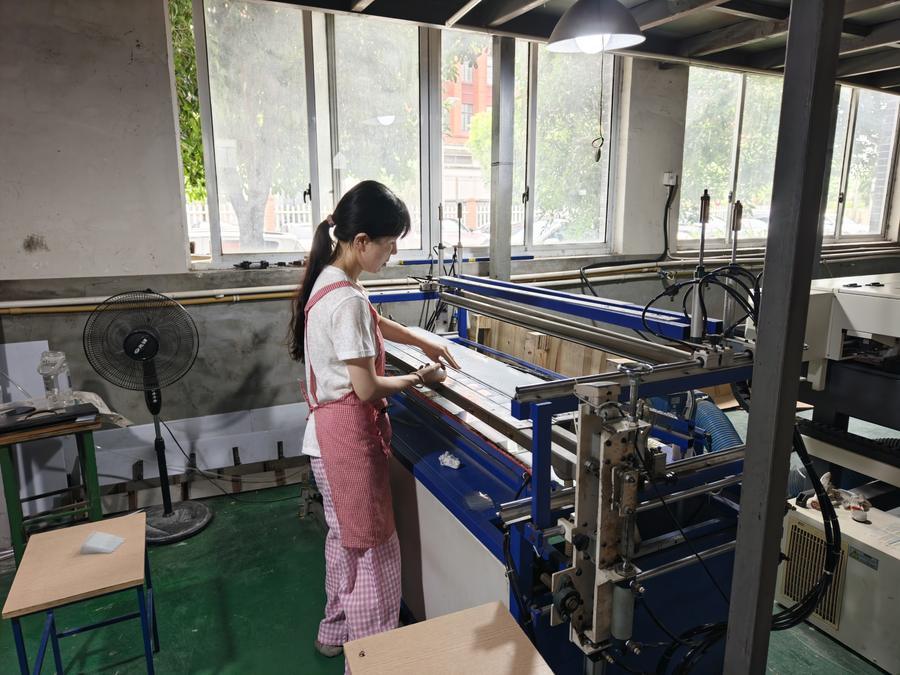 Display production line inside a retail display manufacturing facility