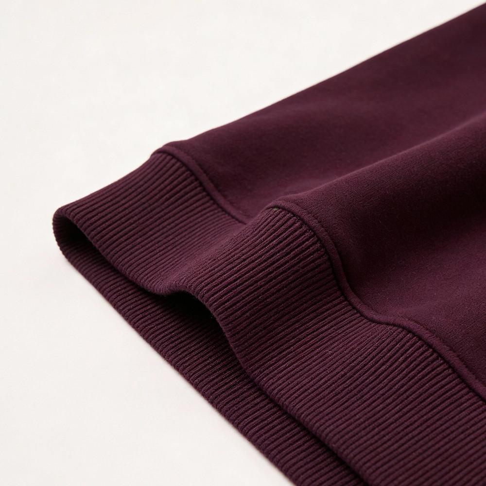 Burgundy ribbed hem detail of sweatshirt