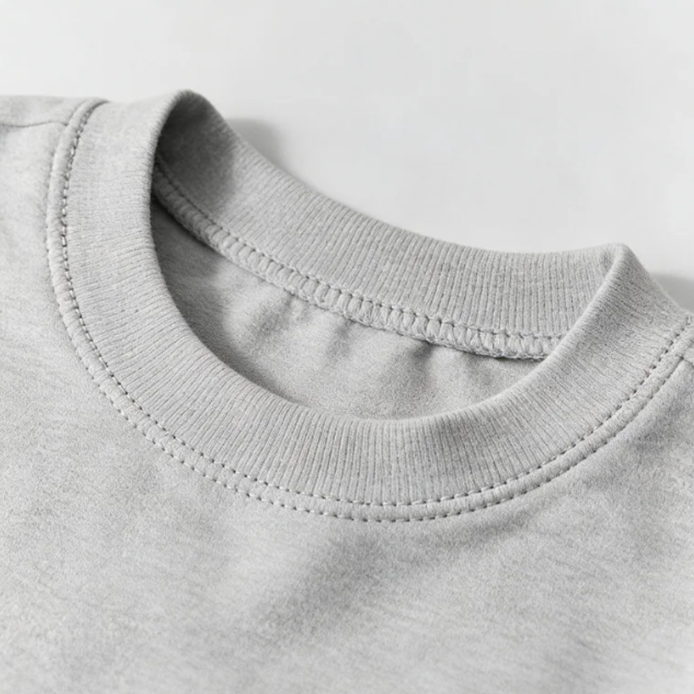 Crew neck detail of grey modal pullover