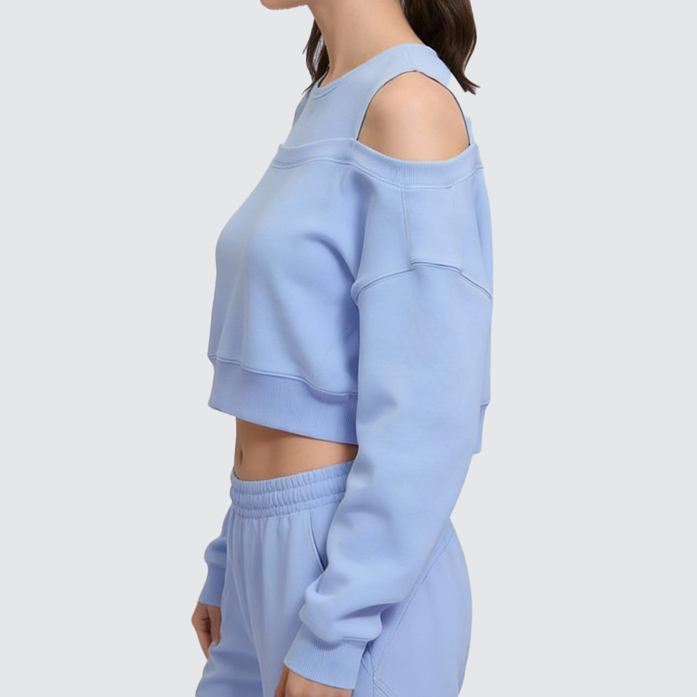 Cropped fit side view of cut out pullover