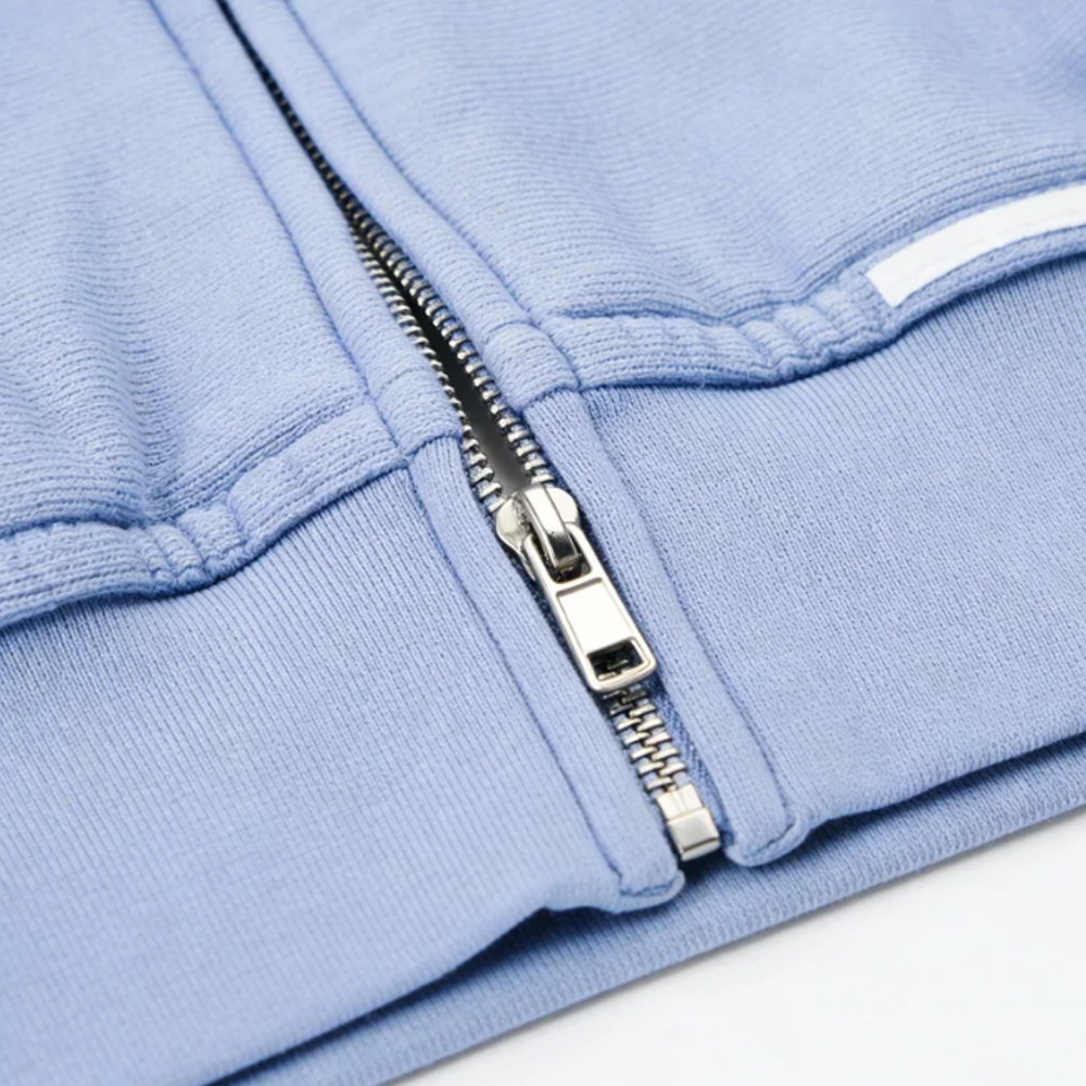 Silver metal zipper detail on grey hoodie