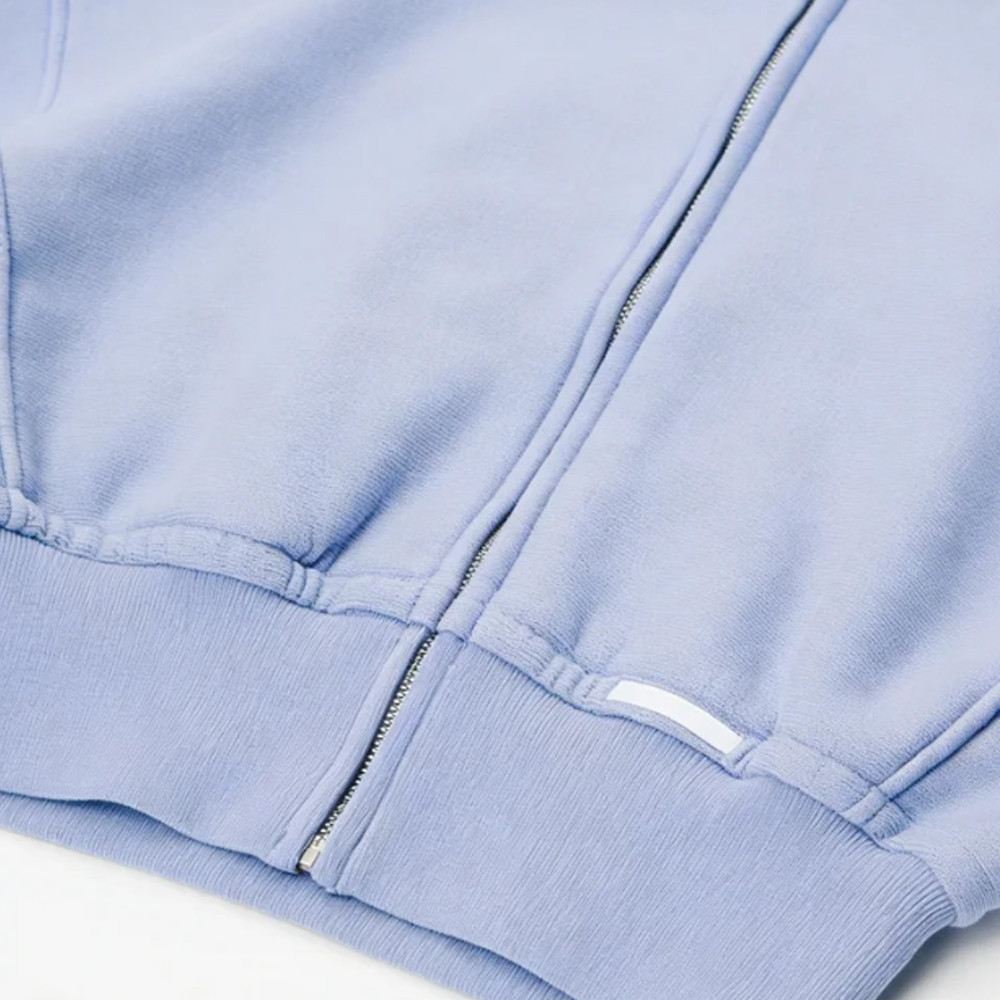 Ribbed knit sleeve cuff detail on blue hoodie