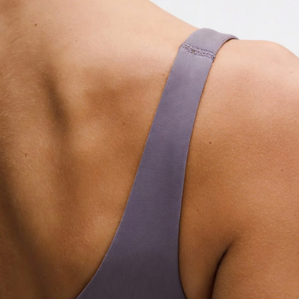 Close-up of the purple shoulder strap stitching