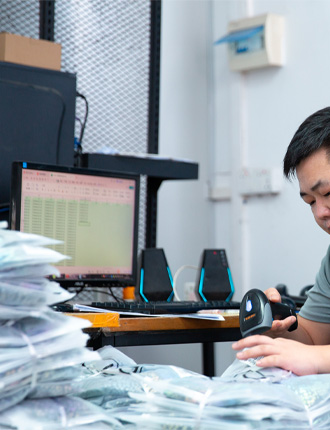 Final packaging and barcode scanning service for retail-ready private label activewear shipping.